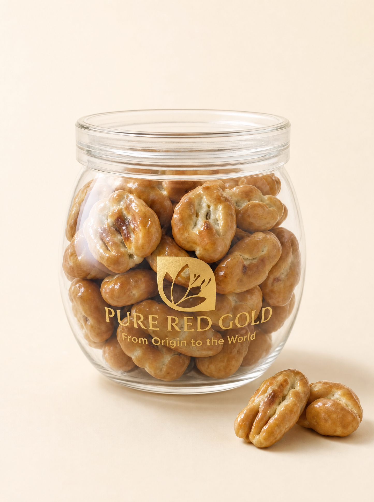 Pecan caramel confection in a Pure Red Gold gift box on warm ivory