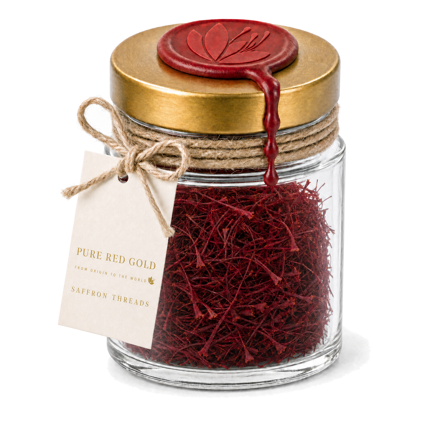 Clear glass jar of Super Negin saffron threads with a brushed gold screw lid, crimson wax medallion embossed with the crocus, jute twine and a cream hang tag reading PURE RED GOLD - FROM ORIGIN TO THE WORLD - SAFFRON THREADS, on white